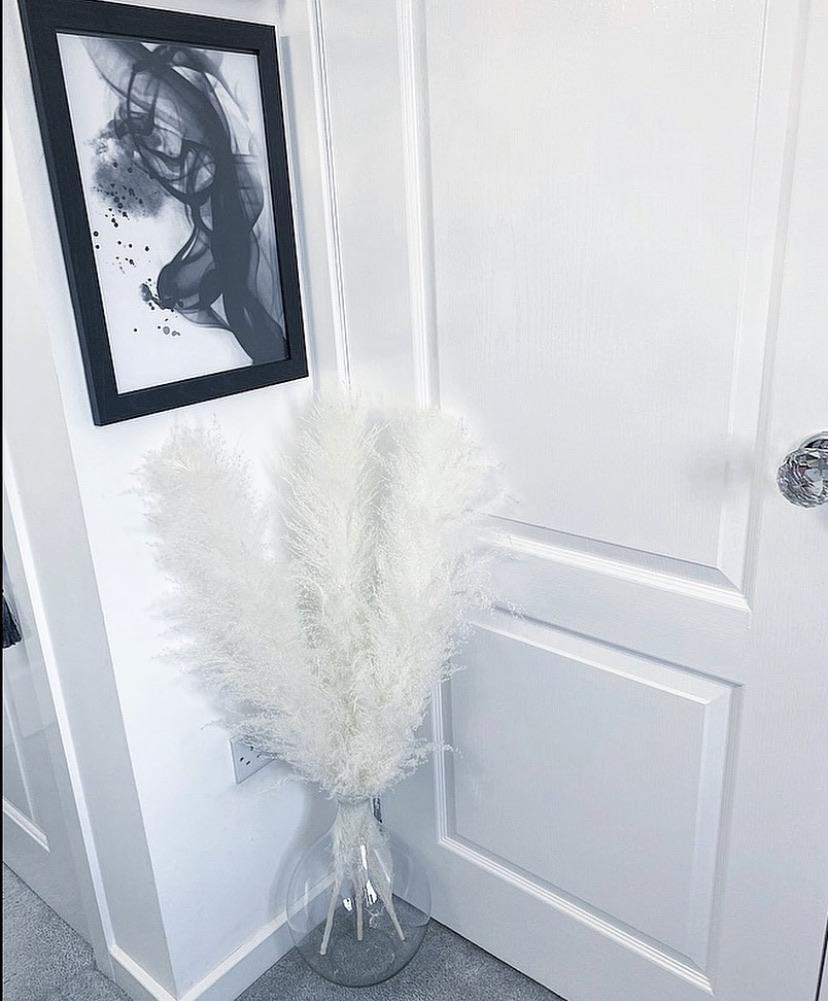 Large white fluffy pampas. Style in a large floor vase or on a console table as a statement piece.