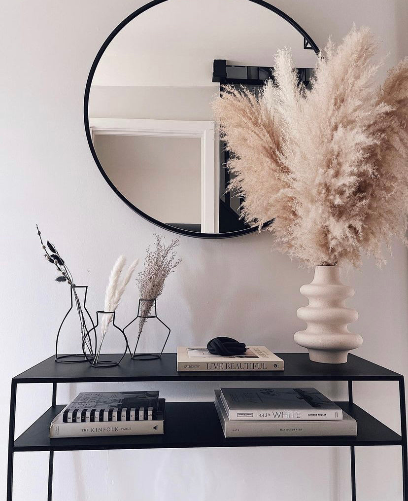 Large fluffy pampas. A natural beige tone makes them the perfect stem for neutral home decor. Style in a large floor vase or on a console table as a statement piece.